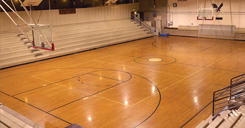 Empty basketball court in a school gymnasium